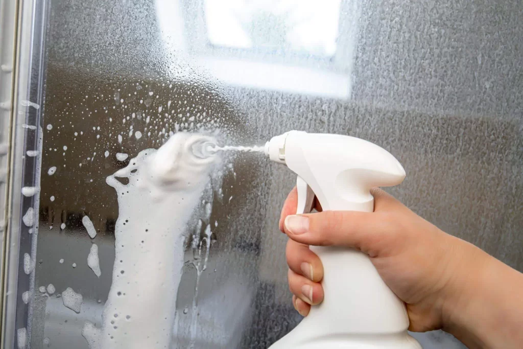 clean glass shower with dish soap